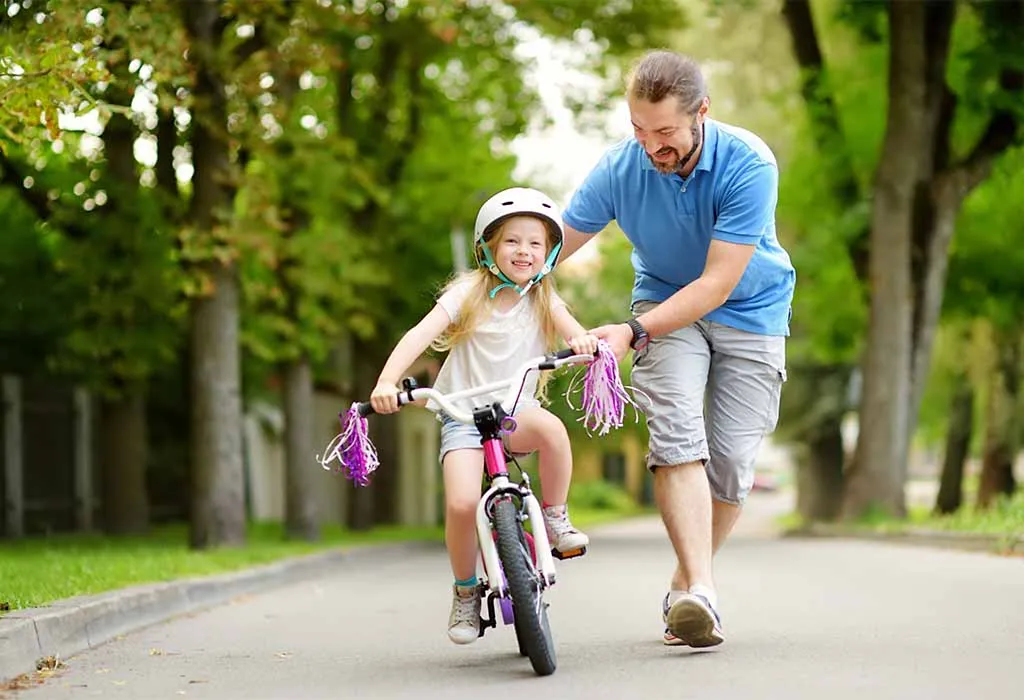 Father Teaching Child to Ride a Bike
