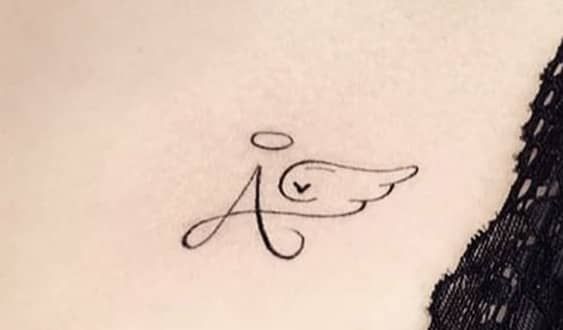 Baby’s Initial with Tiny Halo tattoo