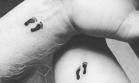 Tiny Footprints on Each Wrist couple tattoo
