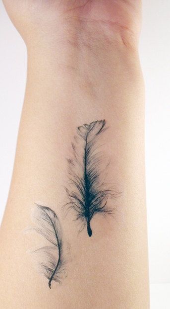 Two Feathers Floating tattoo