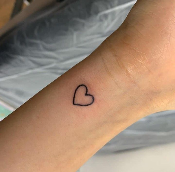 Tiny Heart Outline tattoo